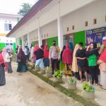 Beri Rasa Aman, Bhabinkamtibmas Polsek Mambi Laksanakan Pengamanan Vaksin